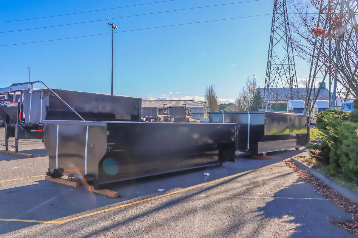 Roll-off dumpster ready for waste disposal at job site for Demolition Dumpster Rental in Amherst